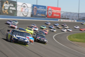 Lowe's #48 car leads out of turn 2 during the Pepsi Max 400 on Oct 10 2010 at the Auto Club Speedway.